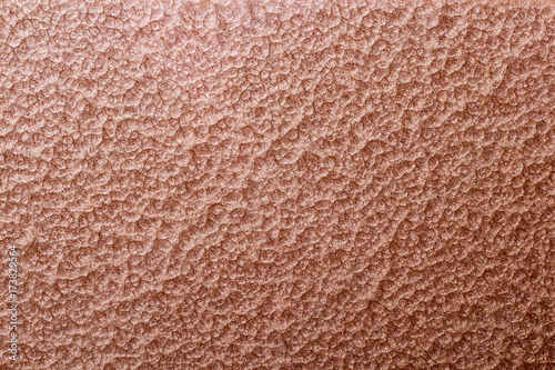 bronze or copper hammered metal background,abstract metalic texture, sheet of metal surface painted with hammer paint
