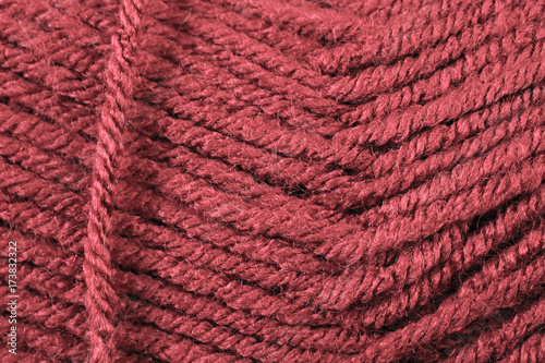 A super close up image of scarlet yarn 