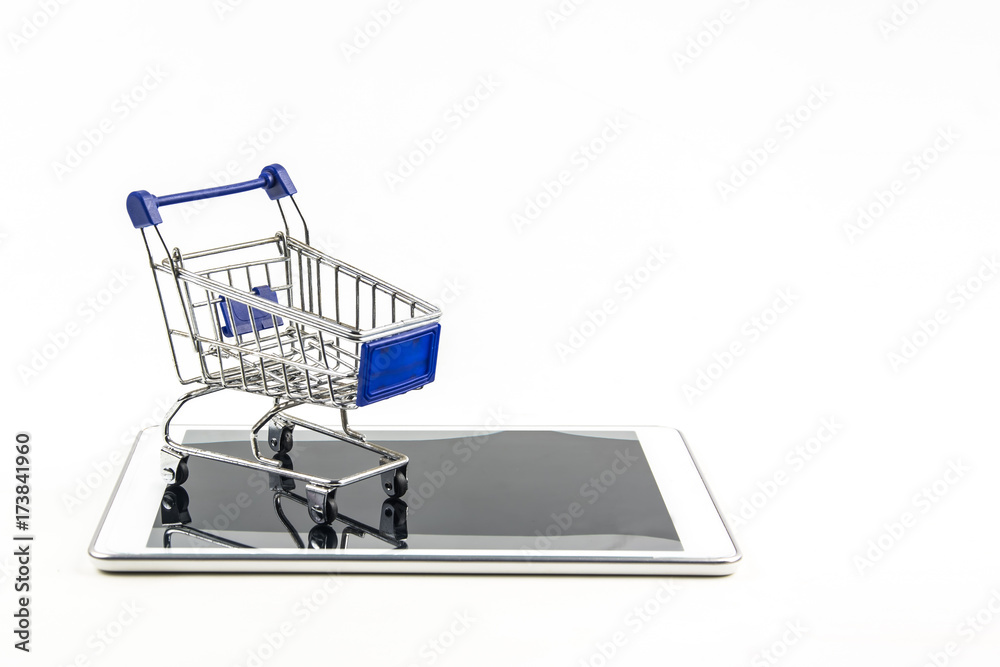 shopping cart with tablet on white backgrond , Means shopping online