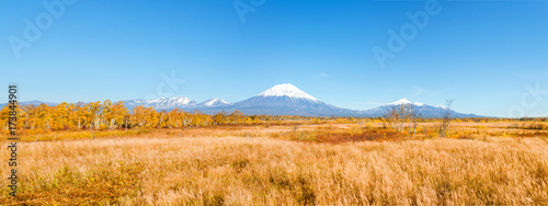 Kamchatka landscape. beautiful autumn view of the active Koryak Volcano and blue sky on clear sunny day.