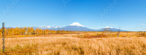 Kamchatka landscape. beautiful autumn view of the active Koryak Volcano and blue sky on clear sunny day. photo