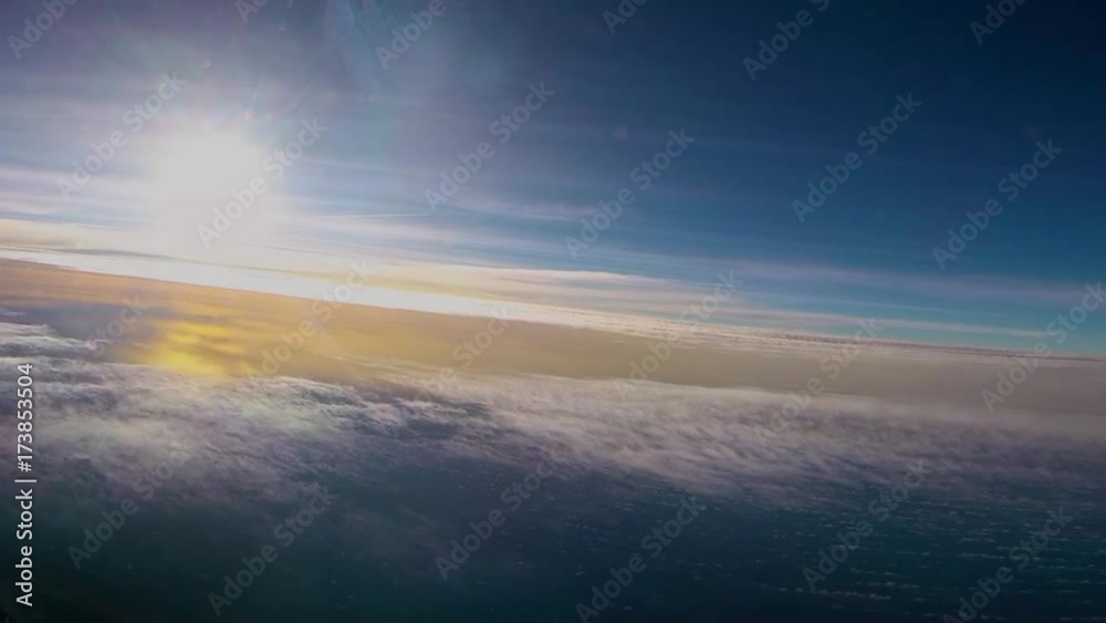 PRECIOUS AIRCRAFT BLUE SKY AND THE REFLECTION OF THE SUN ON THE SEA AND CLOUDS AT SUNSET FROM THE CABIN OF A COMMERCIAL FLIGHT AIRPLANE, SPAIN PRECIOUS AIRCRAFT BLUE SKY AND THE REFLECTION OF THE SUN ON THE SEA AND CLOUDS AT SUNSET FROM THE CABIN OF A COMMERCIAL FLIGHT AIRPLANE, SPAIN