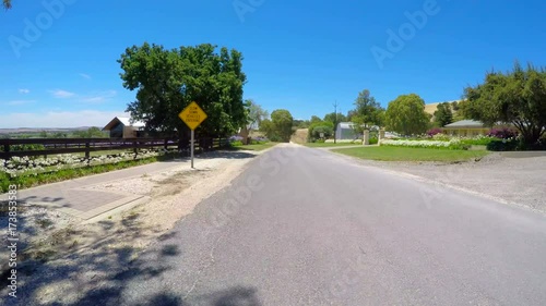 Vehicle POV driving through rural South Australian, Barossa Valley, wine region, driving along Lily Farm Road overlooking the valley. photo