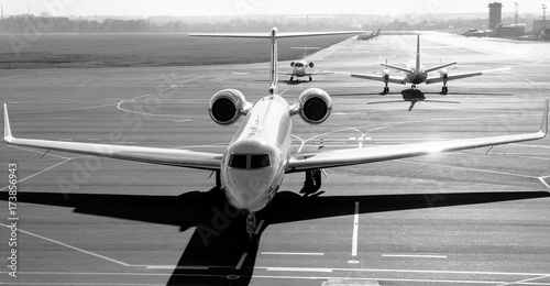 Private jet planes on the landing line in the morning time.