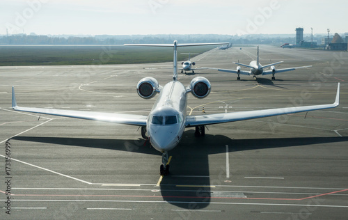 Private jet planes on the landing line in the morning time.
