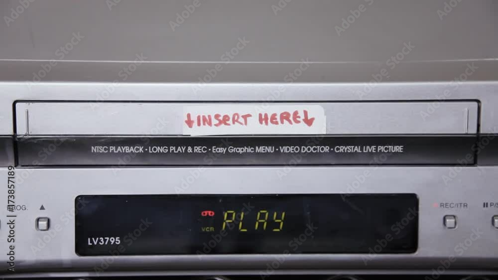 Inserting and removing a VHS tape from a VCR. The title says Our Valentine.
Inserting and removing a VHS tape from a VCR. The title says Our Valentine.