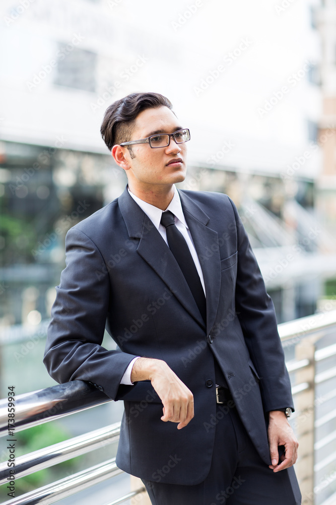 Young asian businessman working outdoors Young asian businessman working outdoors