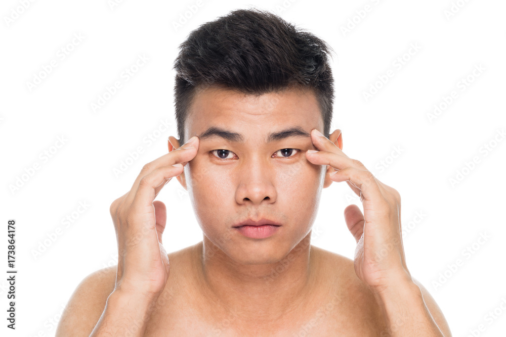 Handsome man worry about his wrinkles close up portrait studio on white background Handsome man worry about his wrinkles close up portrait studio on white background