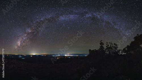 Panorama Milky way galaxy with knob stone ground is name Lan Hin Pum viewpoint at Phu Hin Rong Kla National Park in Phitsanulok, Thailand