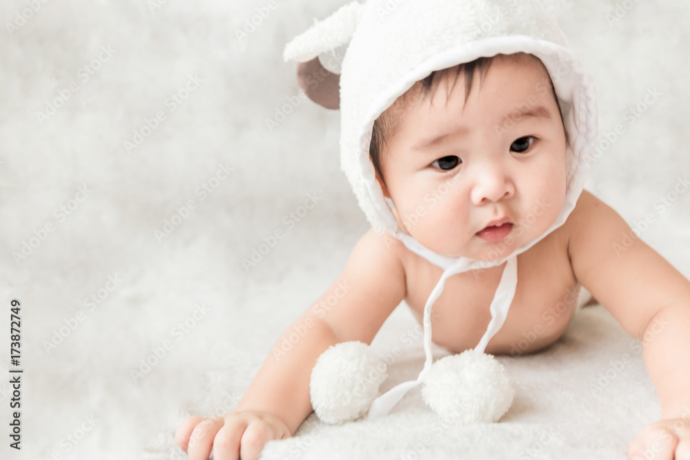 Soft focus Cute Asian male baby lying on a towel. Blurred background. Soft focus Cute Asian male baby lying on a towel. Blurred background.