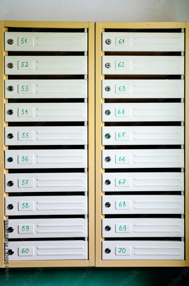 Gray iron mailboxes. Mailboxes in a block of flats. Gray iron mailboxes. Mailboxes in a block of flats.