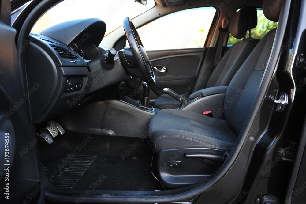 interior of a modern car. Black dashboard interior of a modern car. Black dashboard