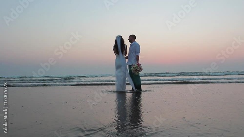 Lovers were married in India. Walk on the beach photo