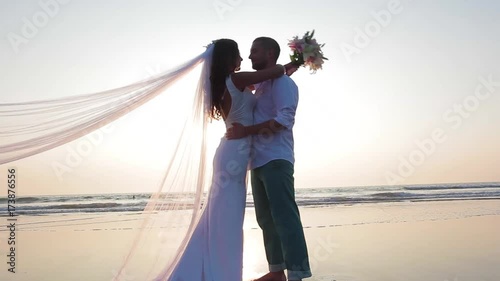 Lovers were married in India. Walk on the beach