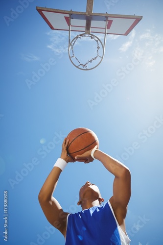 Directly below shot of teenage boy playing basketball © wavebreak3
