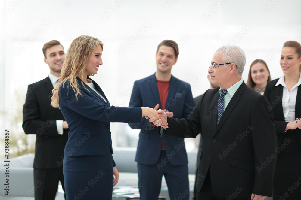 handshake serious businessman and business woman handshake serious businessman and business woman
