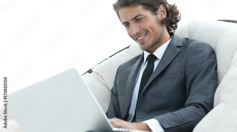 close-up of smiling businesswoman working with laptop in living room. close-up of smiling businesswoman working with laptop in living room.