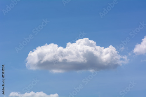 The blue cloudy sky on bright natural background.