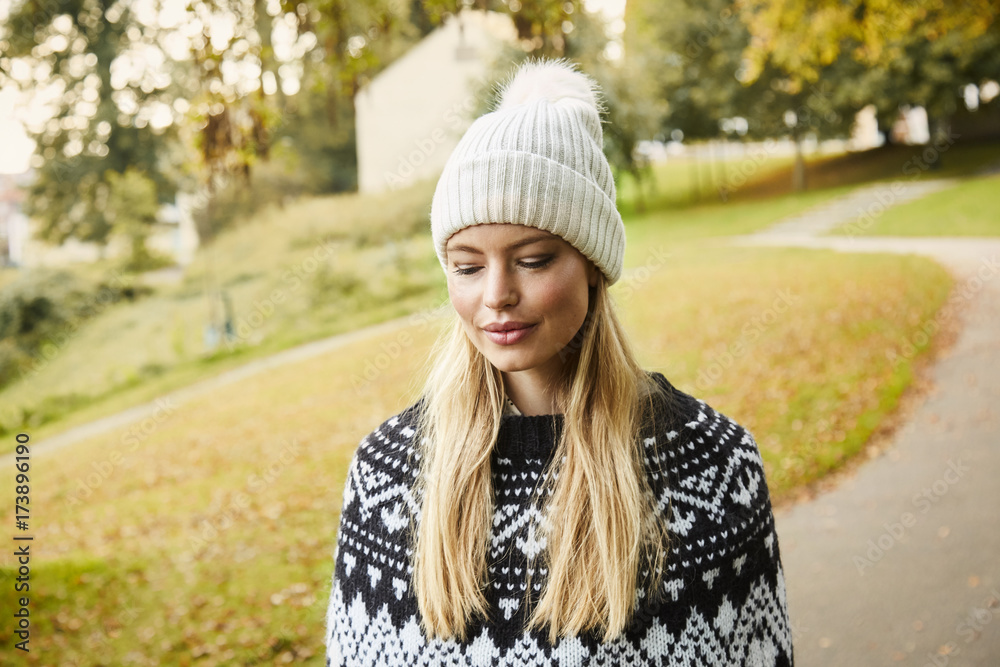 Beautiful blond woman in park, looking disown Beautiful blond woman in park, looking disown