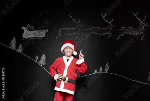 Portrait of boy in santa claus costume