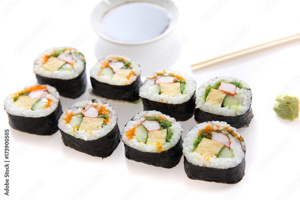 Futomaki sushi , Japanese roll rice egg avocado cucumber and caviar isolated in white background Futomaki sushi , Japanese roll rice egg avocado cucumber and caviar isolated in white background
