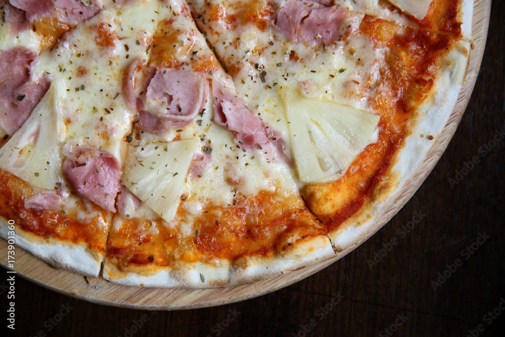 pizza hawaiian , pizza with pineapple and ham with cheese and tomatoes sauce on wood background , italian food pizza hawaiian , pizza with pineapple and ham with cheese and tomatoes sauce on wood background , italian food