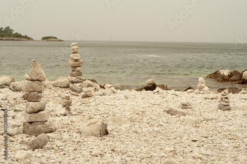 Fototapeta Naklejka Na Ścianę i Meble -  Zen stones on a beach of Rovinj, Croatia.