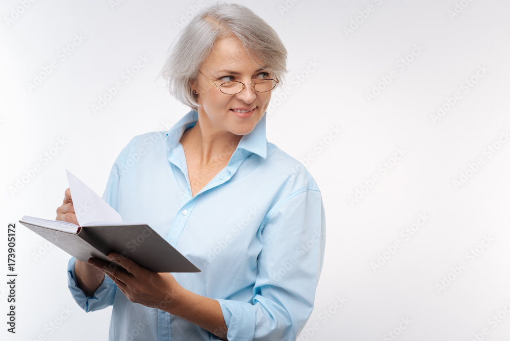 Charming senior woman reading a book Charming senior woman reading a book