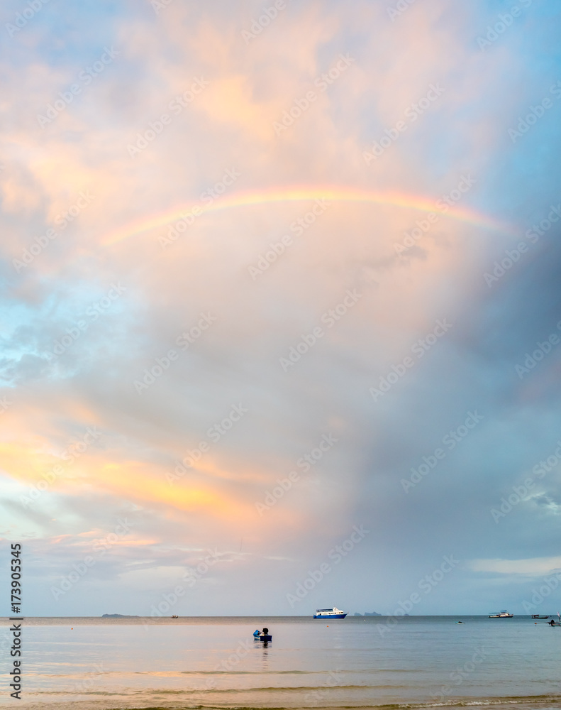 Rainbow and cloudy blue sky Rainbow and cloudy blue sky