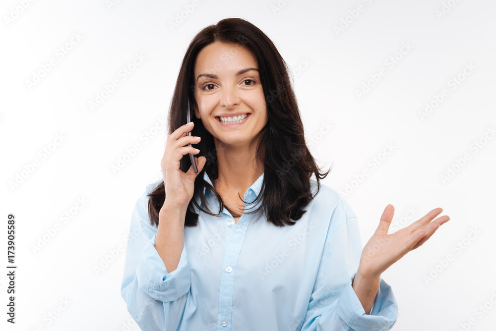 Happy woman having a phone conversation Happy woman having a phone conversation