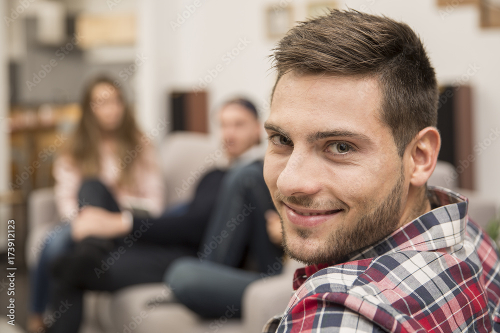 Portrait of handsome guy amongst group of friends Portrait of handsome guy amongst group of friends