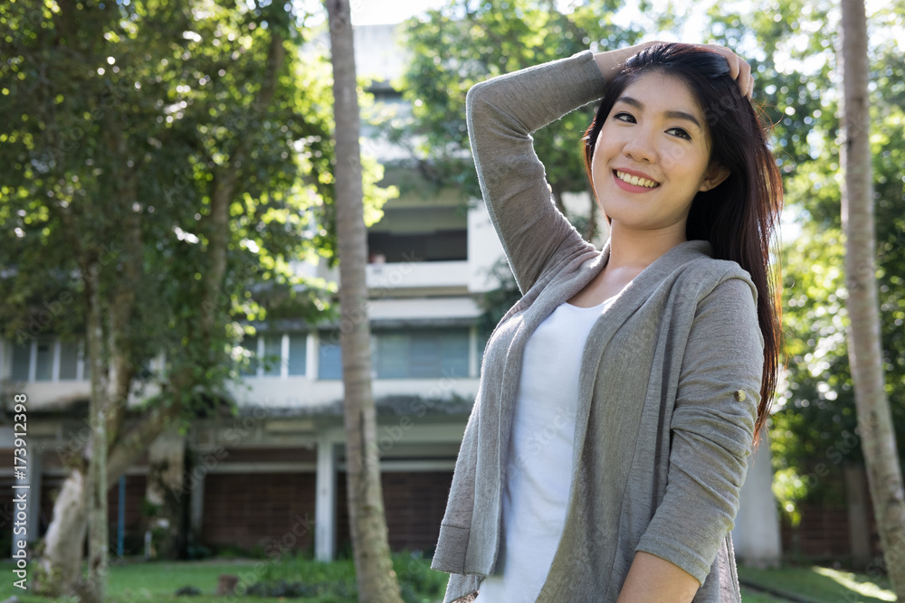 asian woman portrait. young female adult with natural make-up relax in park. attractive teenager smile with happiness in garden asian woman portrait. young female adult with natural make-up relax in park. attractive teenager smile with happiness in garden