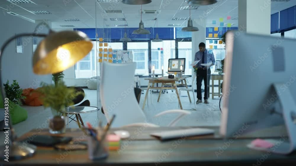 Designer working alone in office, thinking of ideas and working on computer. May depict third party? Designer working alone in office, thinking of ideas and working on computer. May depict third party?