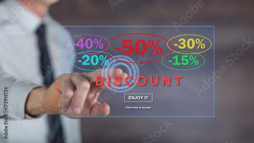Man touching a discount concept on a touch screen