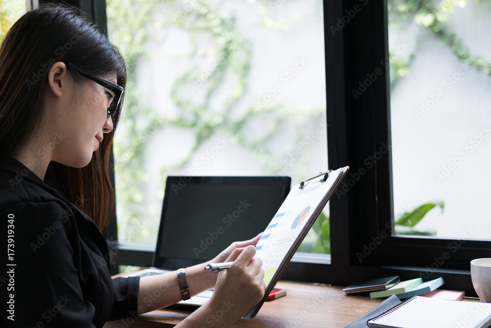 businesswoman plan new business project at workplace. woman analyze market data report at office. finance analyst work with financial graph & chart diagram document. businesswoman plan new business project at workplace. woman analyze market data report at office. finance analyst work with financial graph & chart diagram document.