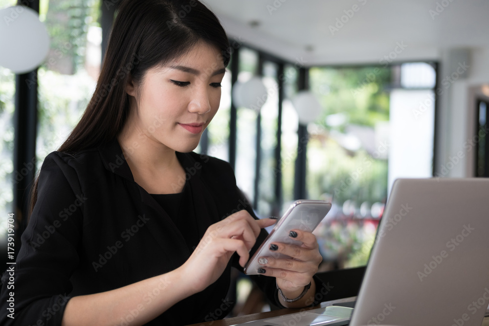 businesswoman use mobile phone at workplace. young woman texting message on smart phone at office. freelancer use cellphone for online network connection at cafe coffee shop. businesswoman use mobile phone at workplace. young woman texting message on smart phone at office. freelancer use cellphone for online network connection at cafe coffee shop.