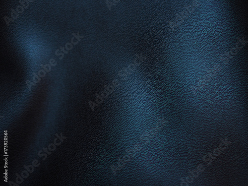 Folded crease wavy black faux leather grainy texture background, with light reflection and shadow, selective focus