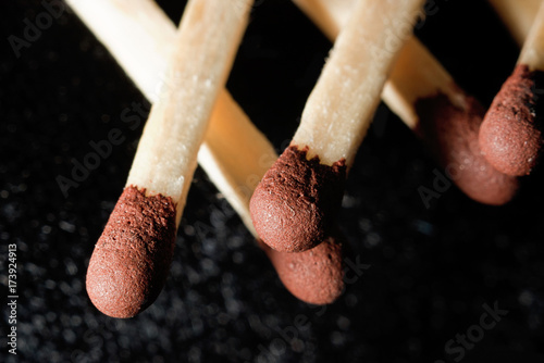 Matches against a dark background, macro photo