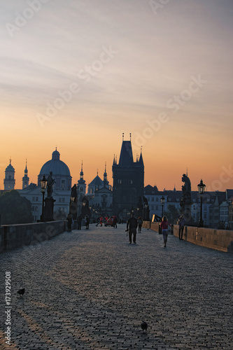Prague, The Czech Republic: AUGUST 23, 2017- Charles Bridge in the early summer morning. The first tourists appeared on the bridge