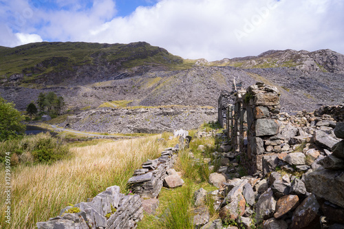 Ruins of a slate building in the countryside of Wales, United Kingdom. Industrial ruins: abandoned slate quarries in North Wales. photo