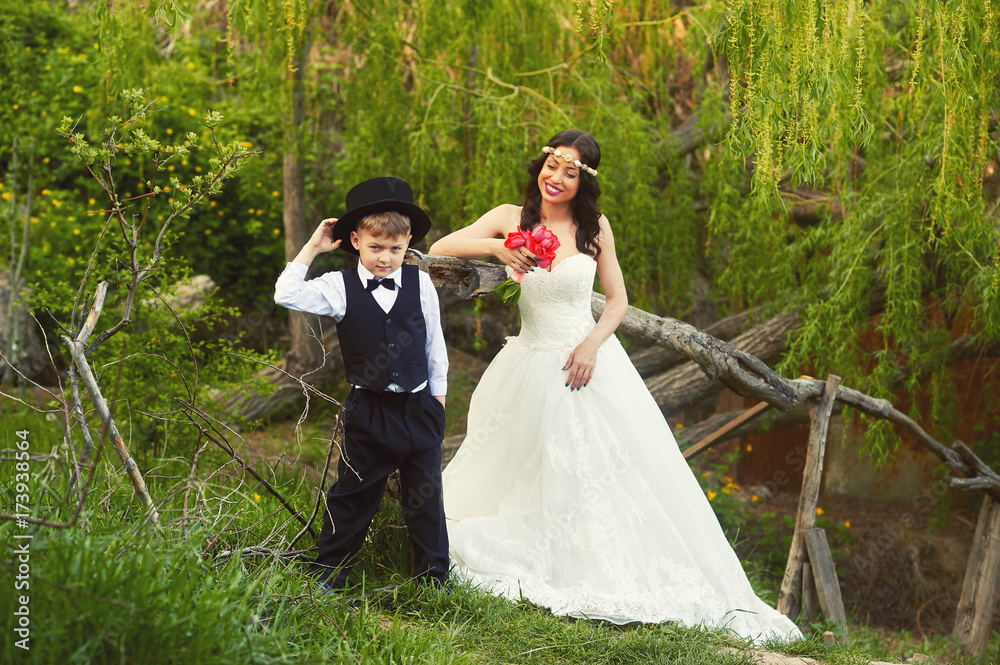 the bride and the little boy dressed gentleman in the Park the bride and the little boy dressed gentleman in the Park