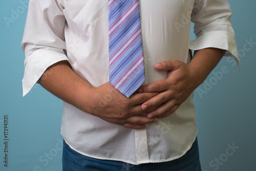 businessman holding his stomach © credon2012