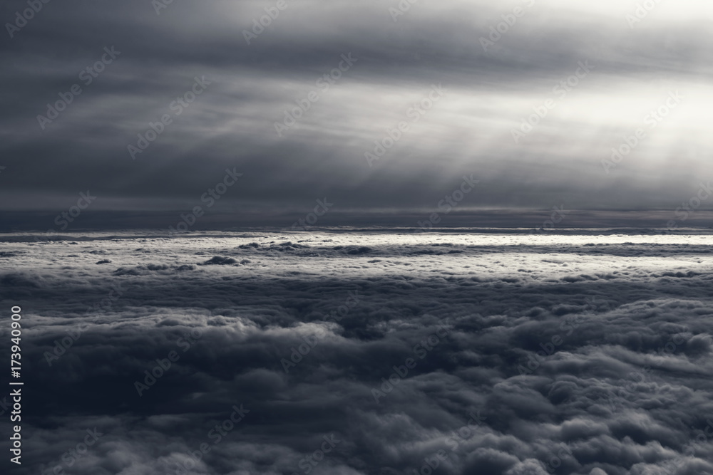 Aerial View Of Sea Of Gray Clouds Surrounded By Rays Of Light Aerial View Of Sea Of Gray Clouds Surrounded By Rays Of Light
