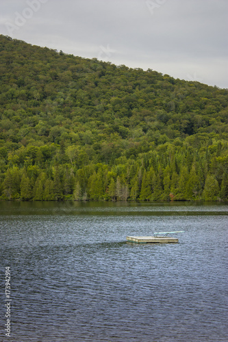 Empty swim platform floating on a lake © S. Lemyre