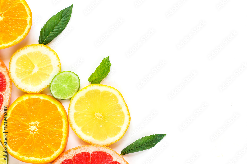 citrus food corner on white background - assorted citrus fruits with mint leaves. Isolated on white background