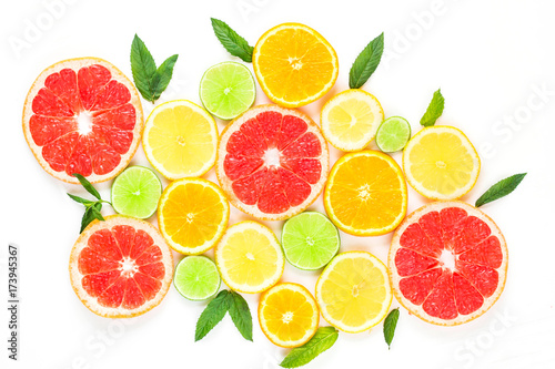 citrus food pattern on white background - assorted citrus fruits with mint leaves. Isolated on white background