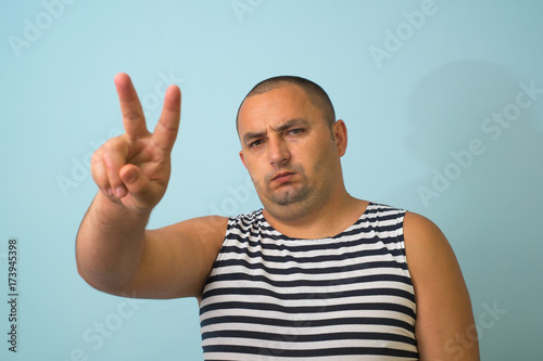man shows two fingers