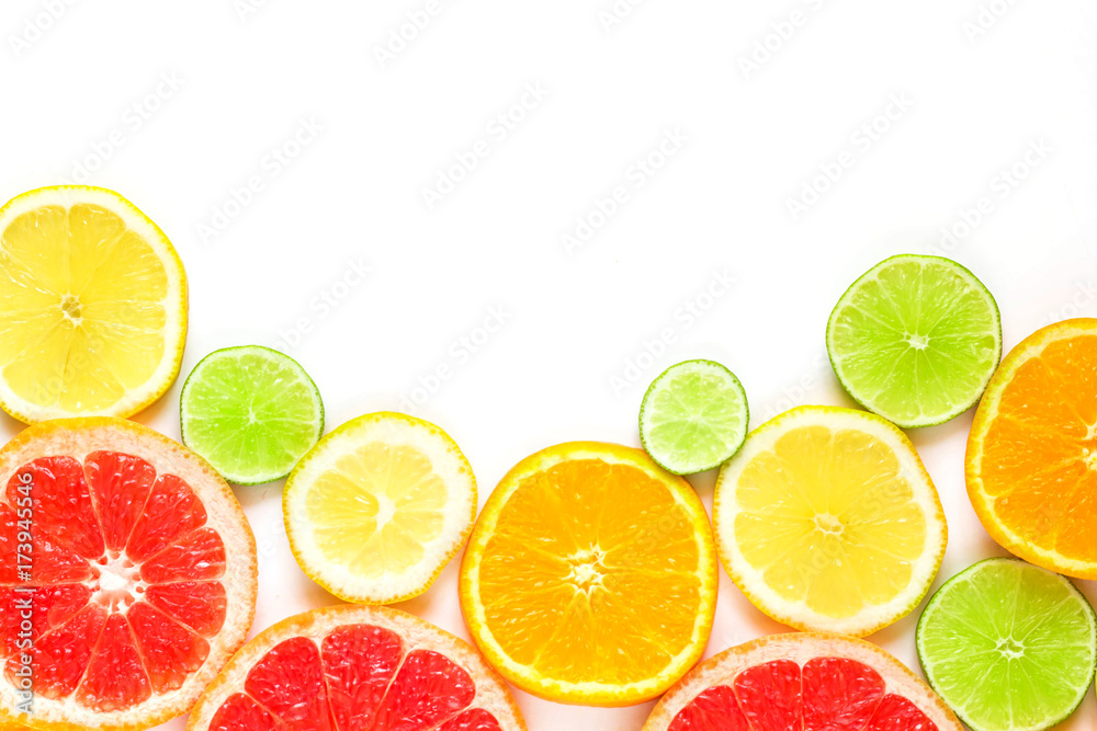 top view of slices of citrus fruits isolated on white background top view of slices of citrus fruits isolated on white background