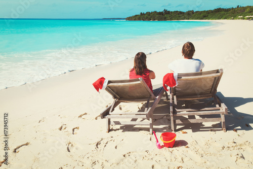 Wallpaper Mural Christmas on beach -chair lounges and happy couple at sea Torontodigital.ca