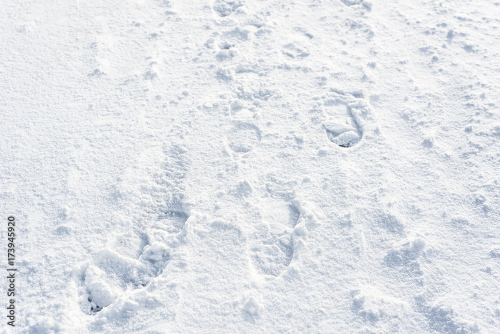 Footprints in snow, clean winter background for design